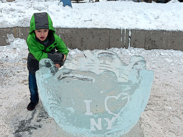 child playing with the ice bowl which rotates and ...