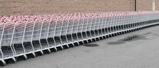 Carts, three abreast at local Costco Store just be...