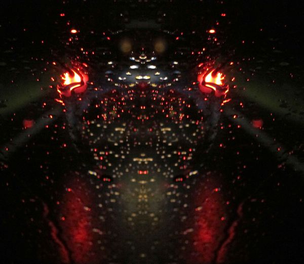 Through the windscreen - lights reflected on the r...