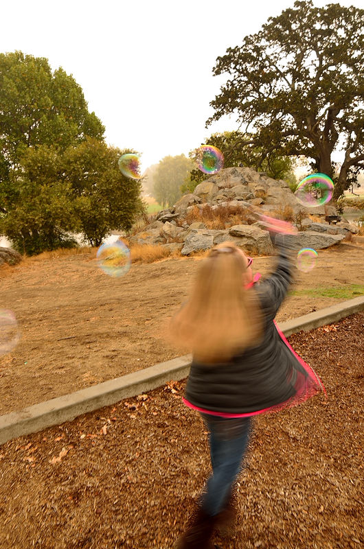 Grand daughter swirling in the bubbles...