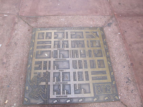 a street plaque in Chinatown shows leading lines t...