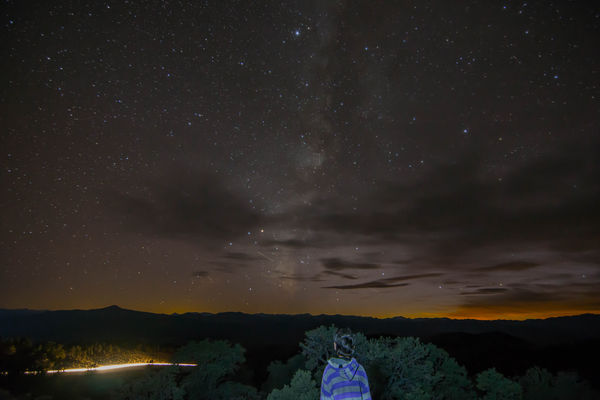 6. Milky Way, car on distant dirt road, and other ...