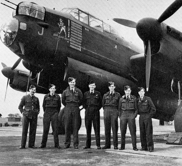An RAF Lancaster bomber crew celebrate its 100th m...