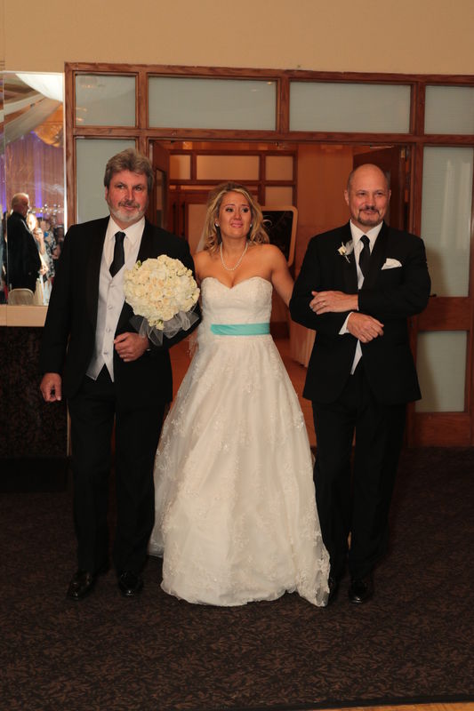 The Bride with her father and step father...
