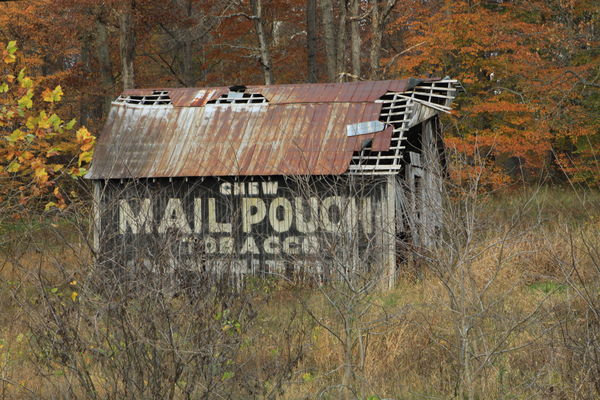 old barn with advertising sign....