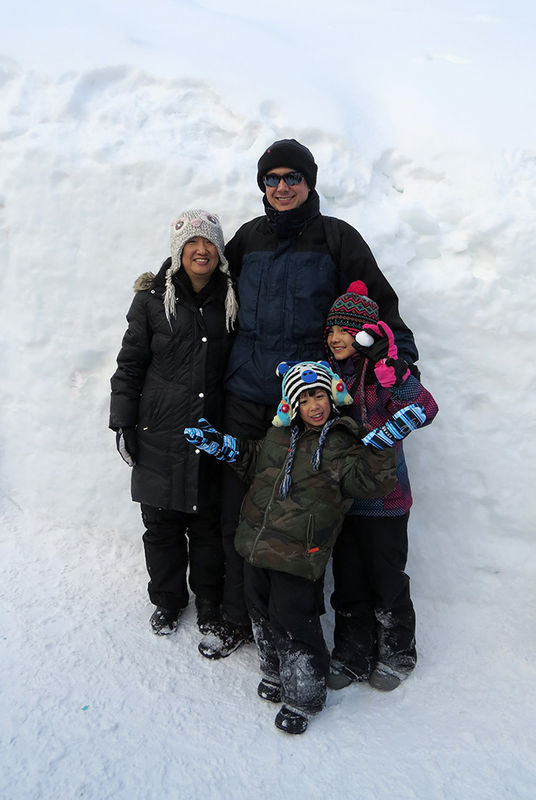 My family in front of lots of snow!...