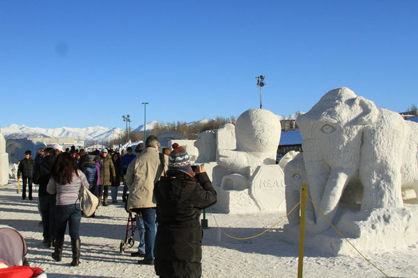 snow sculptures.....a street scene with the crowd ...