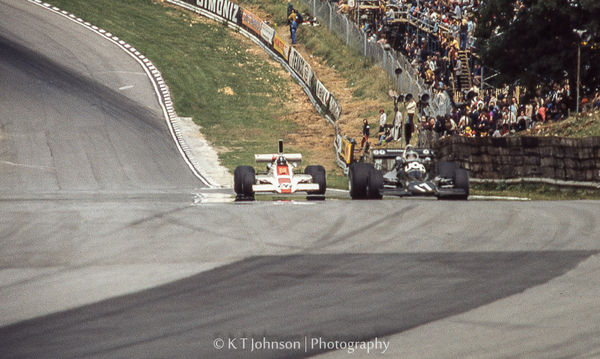 Graham Hill (L), Jean Pierre Jarier  (R) coming up...