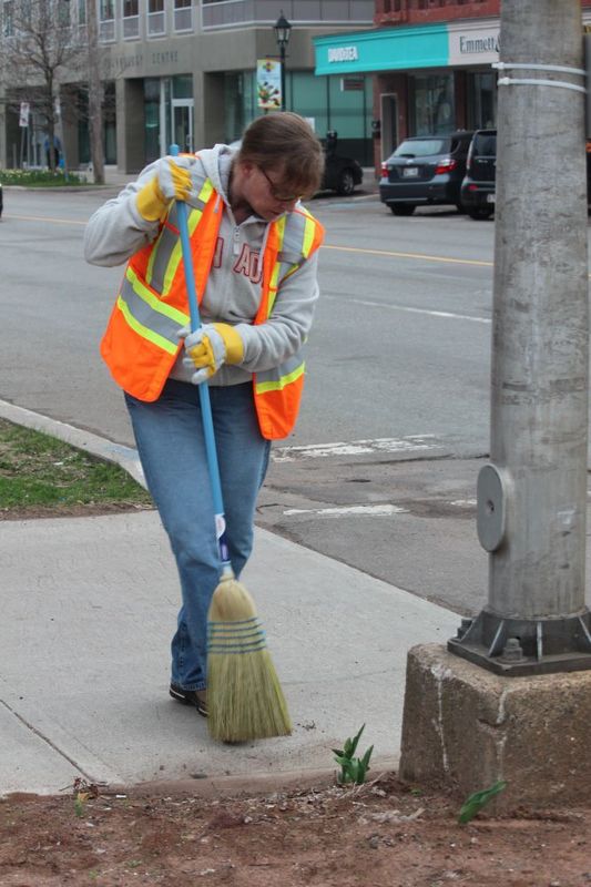 Worker Sweeping.  City cleaning is never done....