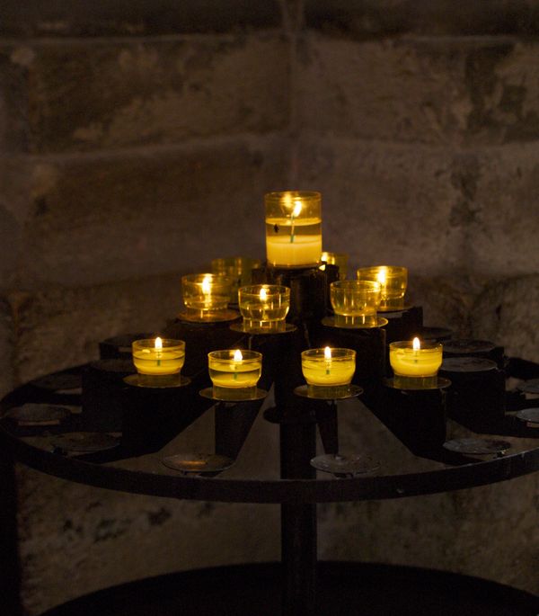 Votive candles in the Cathedral St. Jean Baptiste....