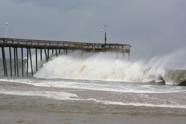Waves hitting pier. Waiting to see if Hurricane co...