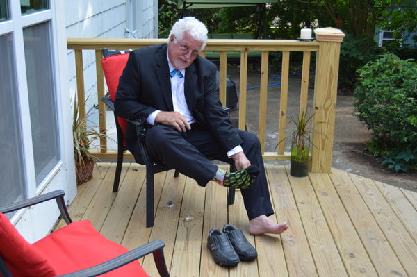 The minister, putting on his socks and shoes...