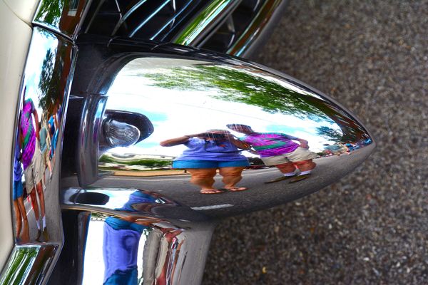 Reflection in Caddy bumper...