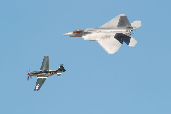 F22 Hornet flying with a P51 Mustang...