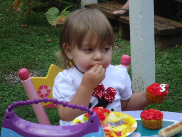 Hailey enjoying her Elmo cupcake!...