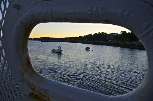 Looking through a ferry's "porthole" fence...