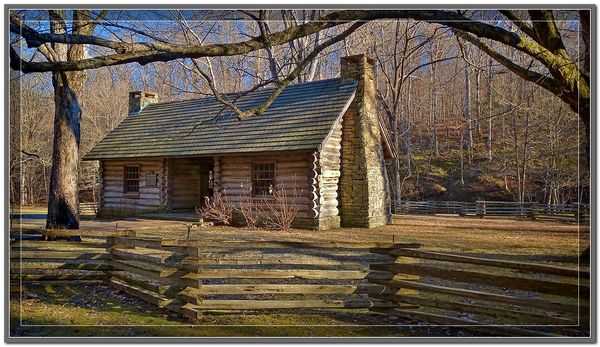 An Old Cabin Deep In The Woods At Sunset