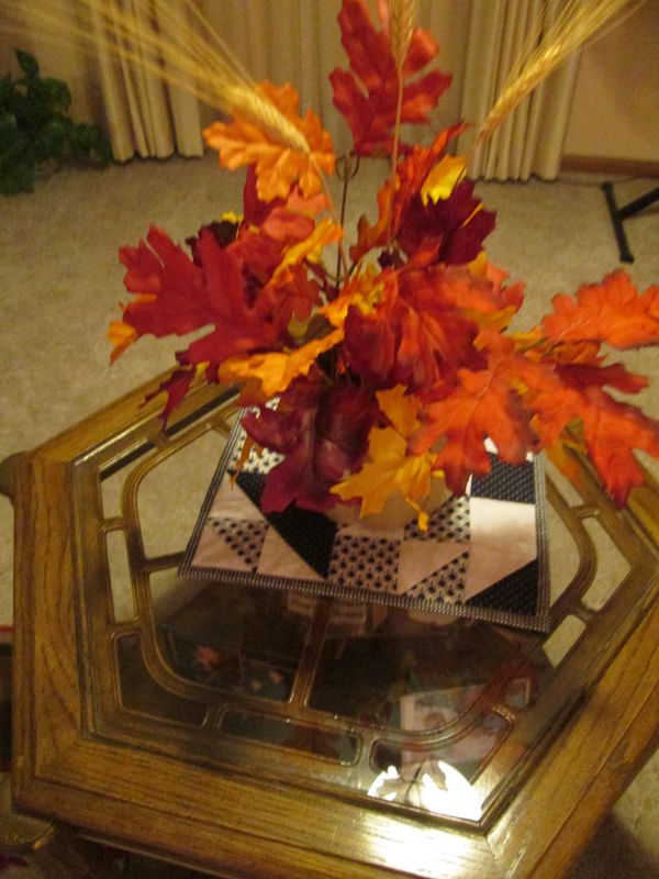 Autumn leaves in ceramic pumpkin vase...