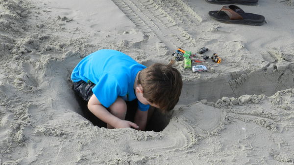 Jack playing in a hole that Daddy dug on the beach...