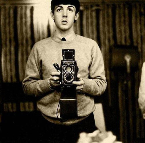 #24. Paul McCartney takes a selfie in 1959....