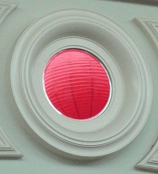 Chinese lantern reflected in circular mirror at Ri...