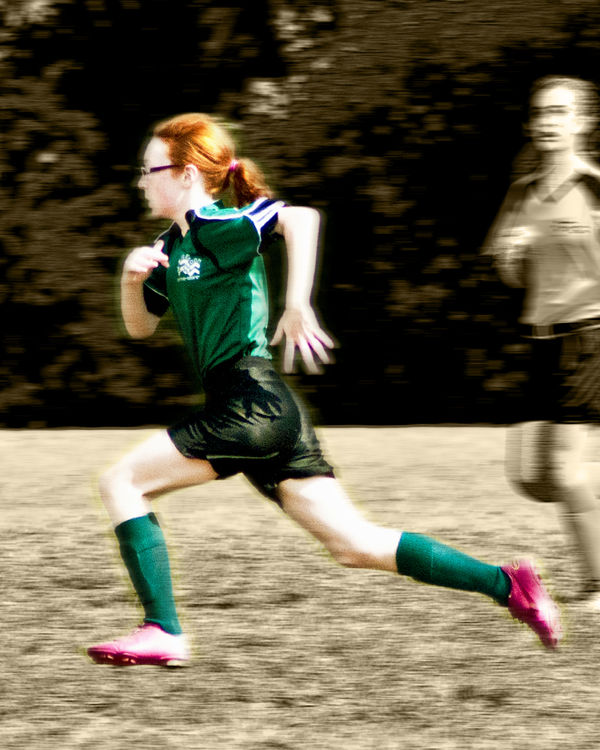 Granddaughter Julia racing down the soccer field...