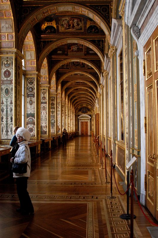 One of the many long hallways lined with paintings...