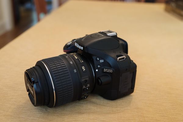 camera + kit lens (18-55 VR); strap included (see ...