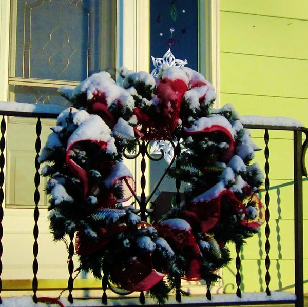 Snow covered Wreath on the railings...