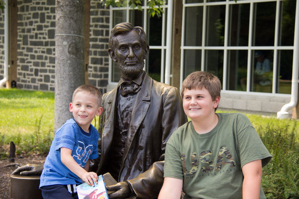 Grandsons with statue of Abraham Lincoln...