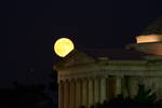 July's second Full Moon, the Blue Moon, rising ove...