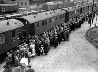 Sudeten ethnic Germans board deportation trains to...
