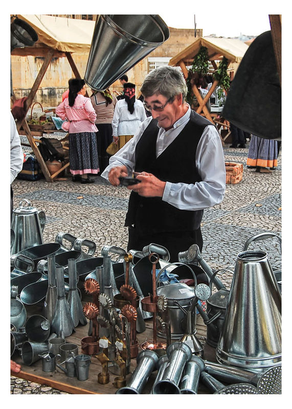 Portuguese tin smith at open market...