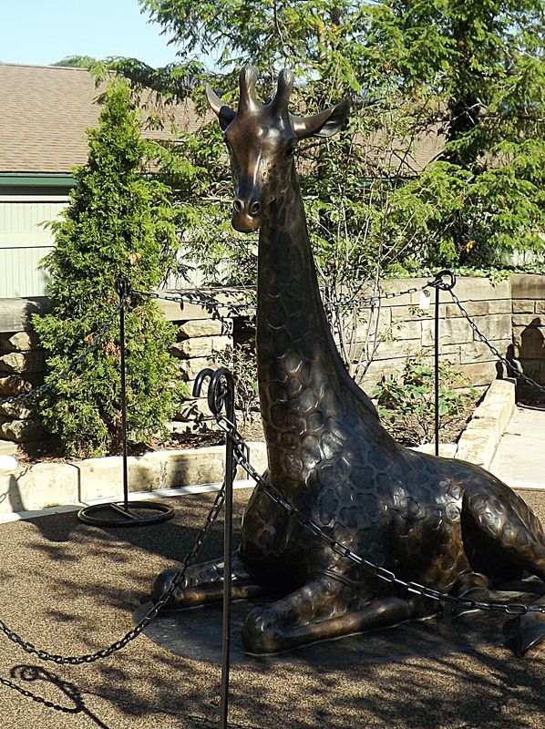 a life size statue of a giraffe, new...