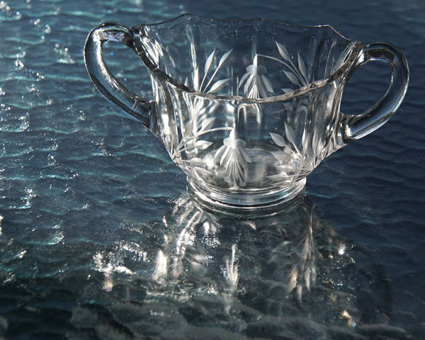 Used natural light....a glass sugar bowl on a glas...