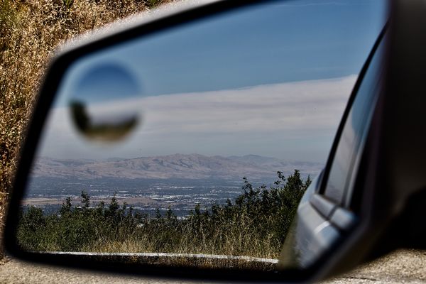 Rear view mirror reflection of San Jose,Ca....