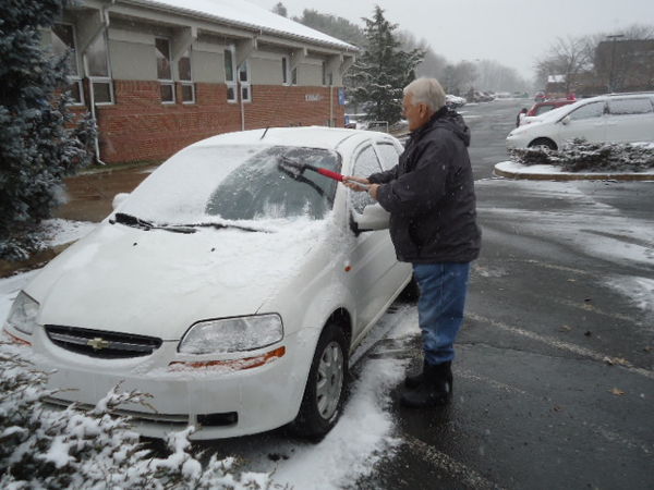 Al brushing snow off the car!...
