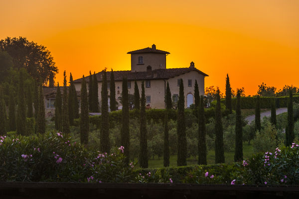 The sun sets behind a home close to the Castello d...
