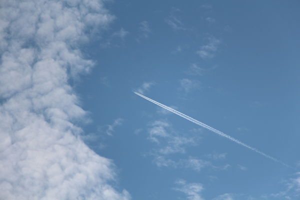 Here's a contrail....moving through the hole in th...