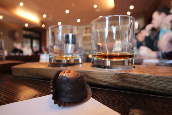 2 different bourbon and a bourbon ball candy to ta...