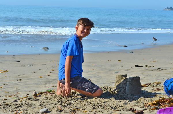 Our grandson building sand castles....