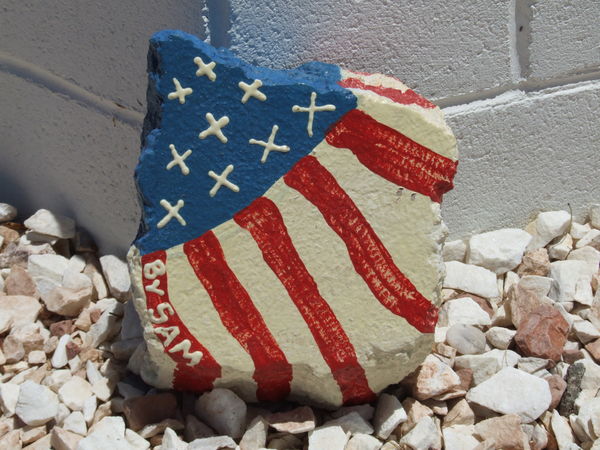 a painted stone by the Moapa Memorial...