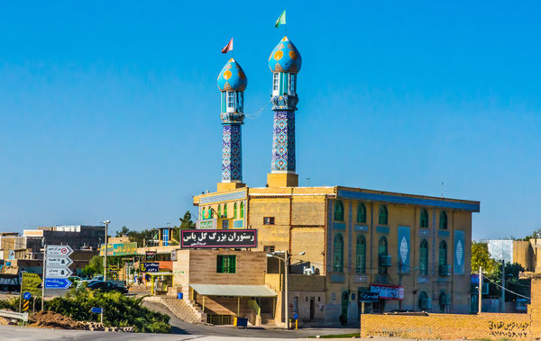Small town mosque with colorful minarets...