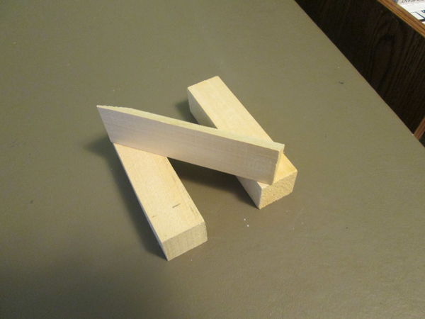 Wood scraps form an "N"...