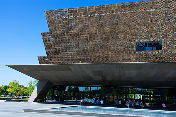 The exterior is covered with 3,600 bronze-colored ...
