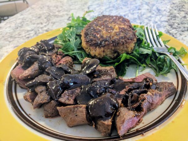 Venison with shiitake mushrooms, shallots, in a re...