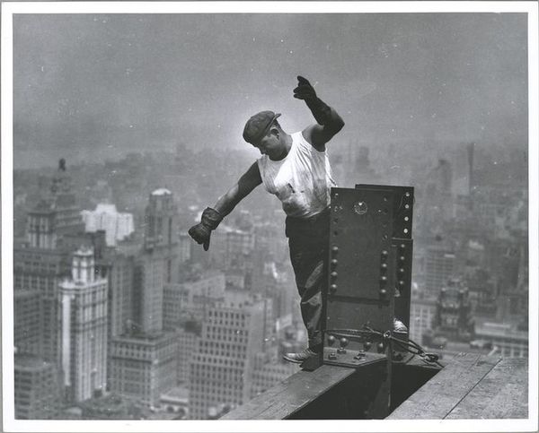 A worker helping to build the Empire State Buildin...