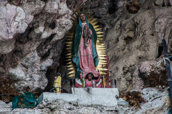 A madonna in a cave high on the cliff wall...