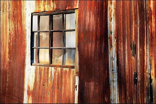 7. Rusty wall of metal shed....