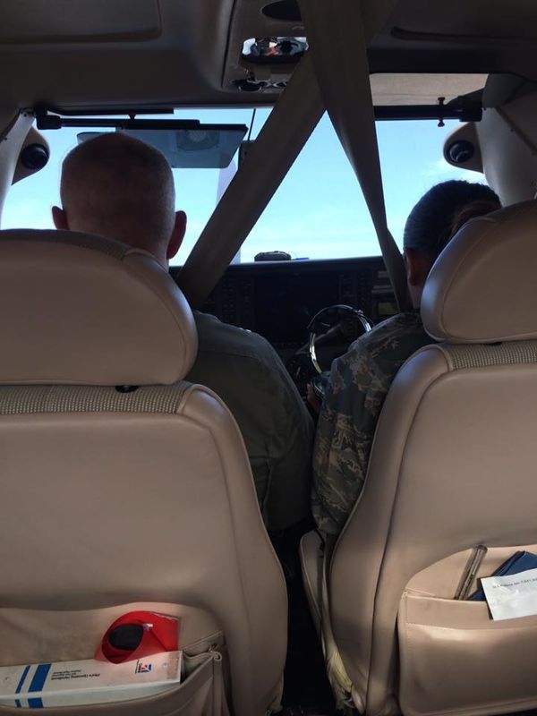 Inside the plane, he flew in the back seat, when t...